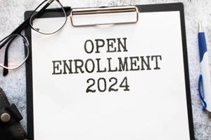 ACA open enrollment 2024. text on a sticker next to money and banknotes